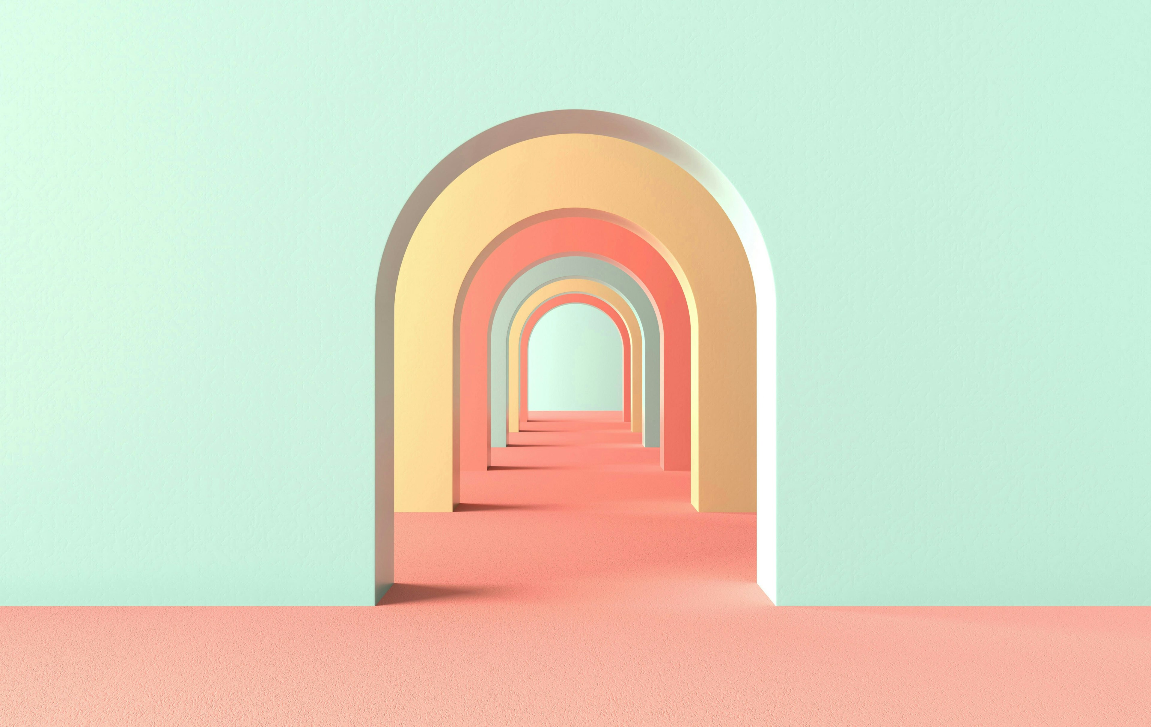 A tunnel of pastel-colored arches in mint green, peach, and yellow, creating a sense of depth and symmetry with soft color contrasts.