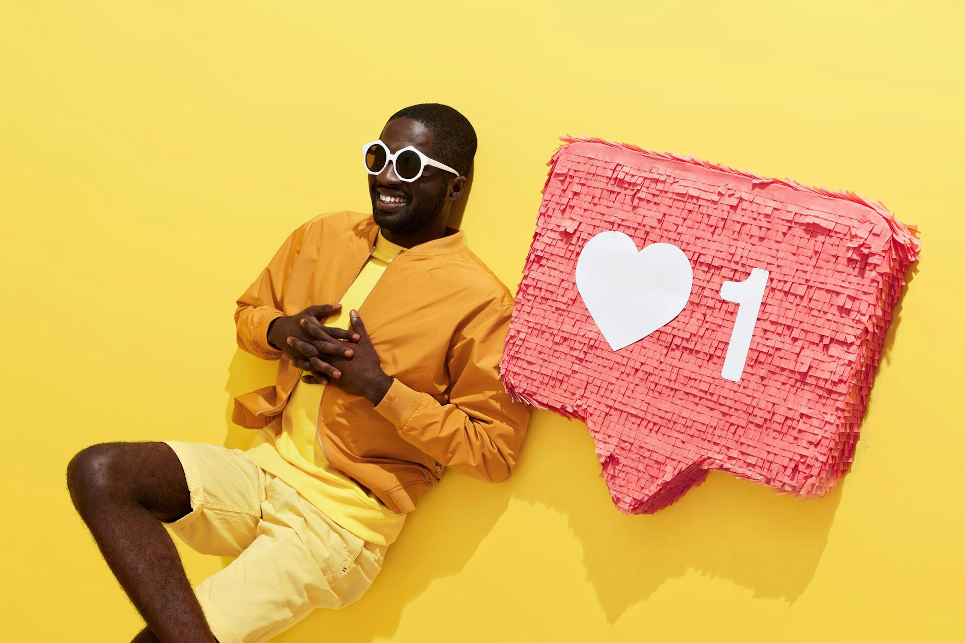 black man with emoticon in yellow